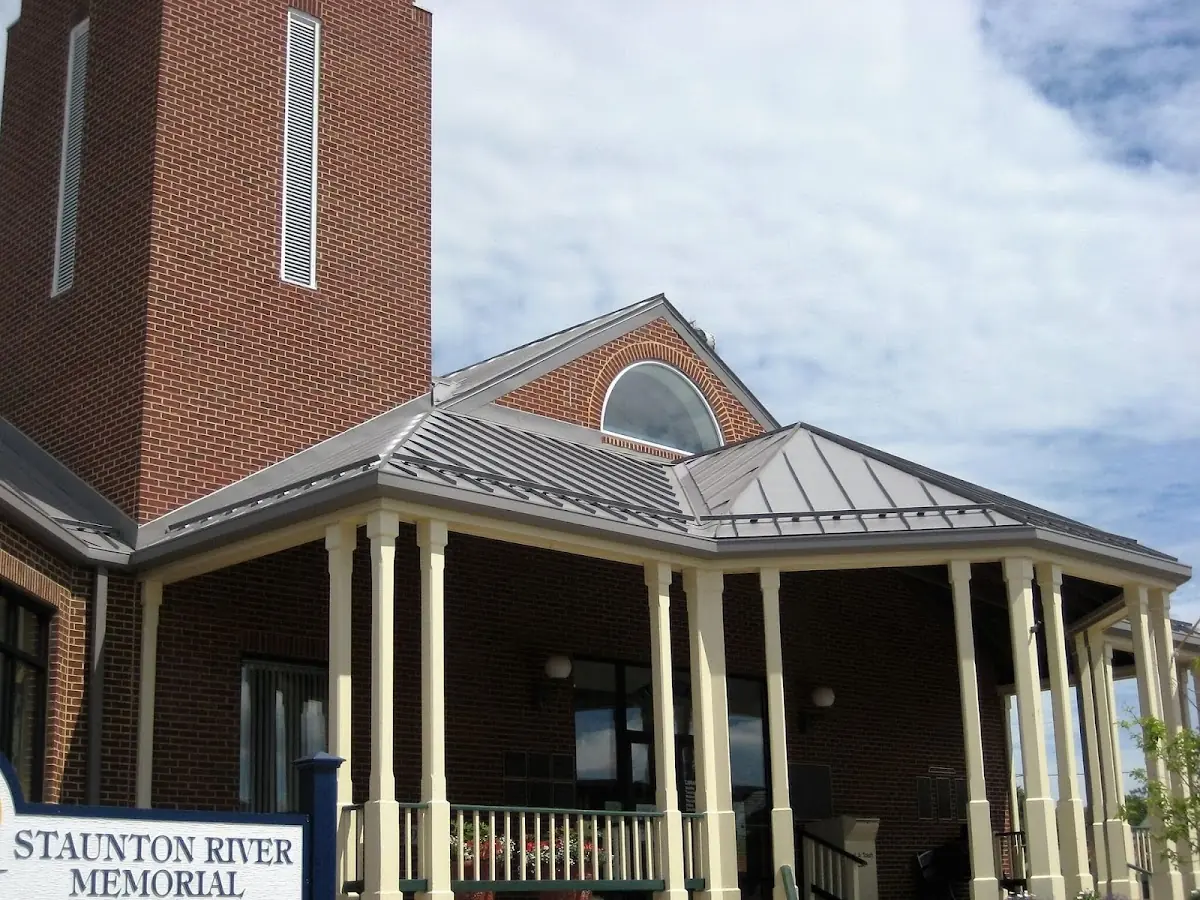 Skilled roofing craftsmen working on a residential roof in West Memphis